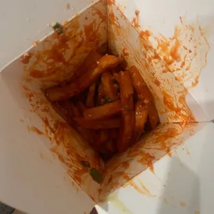 Trolley fries doused in sooo much sauce they are inedible.