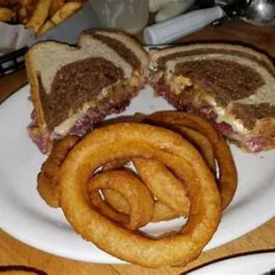 a sandwich and onion rings