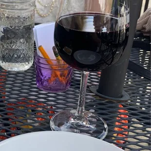 a plate of food and a glass of wine