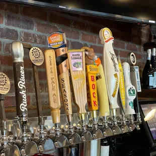 a row of beer taps