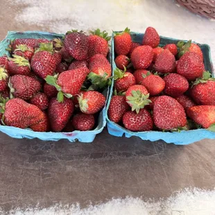 two baskets of strawberries