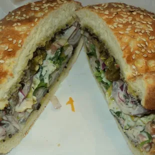 Friend: I didn&apos;t know they sold burgers.  Me: They don&apos;t.  But they do serve this Muffaletta that rivals any burger!