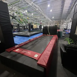 Trampoline. Do not use without supervision as there are large bolts and equipment around