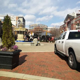 a white truck parked on a brick road