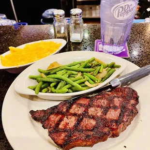 Wagyu strip steak with sautéed green beans and macaroni and cheese