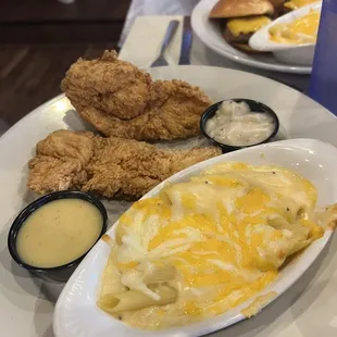 Chicken tenders platter and wagyu sliders in background
