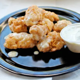 a plate of fried chicken nuggies