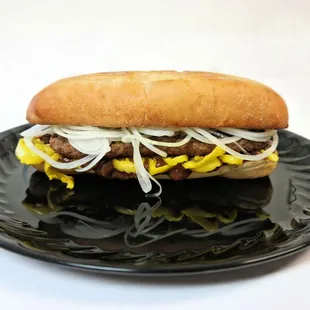 a hot dog on a black plate
