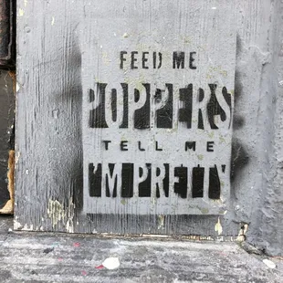 a sign that reads feed me hopers tell me mercy