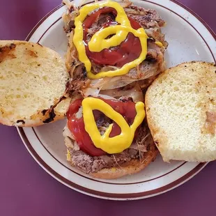 a sandwich with mustard and ketchup