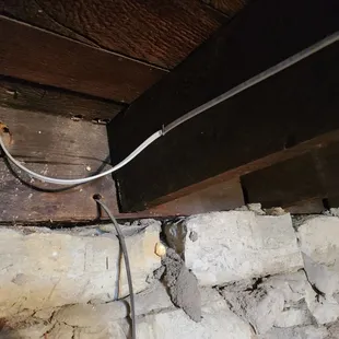 Another one of many pinched romex wires.  Staple was installed too tight. Loosened and it's OK now.