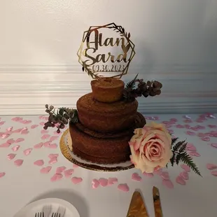 Three tiered cake with large caramel, medium lemon and mini caramel.