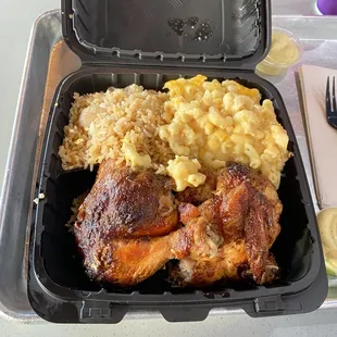 Half chicken dark and white with arroz chaufa  and Mac N Cheese