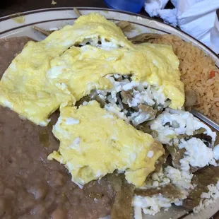 Chilaquiles Verdes, scrambled egg, rice and beans