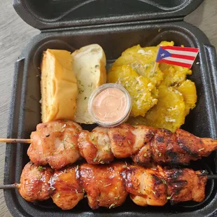 chicken skewers, potatoes, and a hot dog