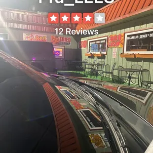 a view of a restaurant from a moving train