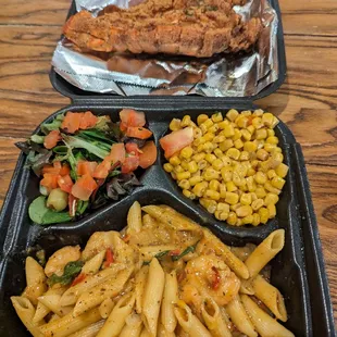 Deep fried lobster tail, Rasta pasta, Cajun corn, and the side salad.
