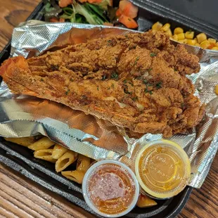 Deep fried lobster tail, Rasta pasta, Cajun corn, and the side salad.