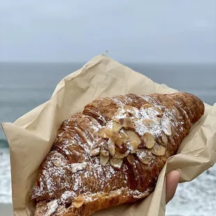 Almond Croissant with a view of Moonlight Beach