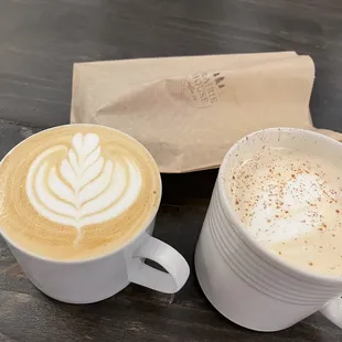 two cups of coffee on a table