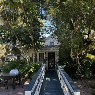 a bridge leading to a cafe