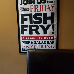 a fish fry poster on a wall