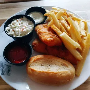 a plate of fish and fries with coleslaw and coleslaw slaw