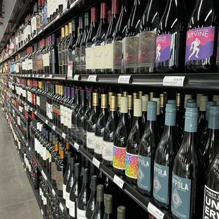 rows of wine bottles in a store