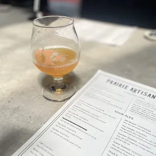a glass of beer on a table
