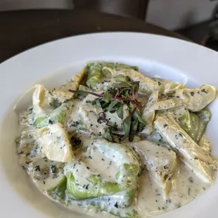 Spinach &amp; Artichoke Ravioli  |   24
grated parmesan * ricotta * fresh mozzarella * lemon gremolata cream sauce