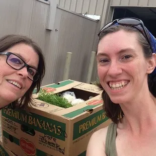 Dropping off organic produce at the food bank
