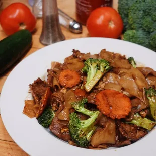 a plate of beef and broccoli