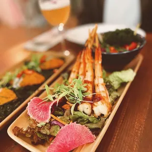 Yum Koong Yang With Sea Grape Seaweed Salad Mixed green, sea grape seaweed mango salsa served with sweet and savory shrimp skewers