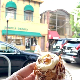a hand holding a pastry