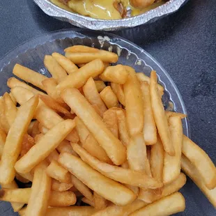 Fries. They came in a paper pouch, which was taped closed with masking tape, direct contact with the fries.