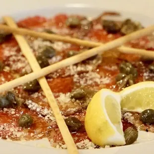 CARPACCIO Beef tenderloin, Extra Virgin Olive Oil, Capers, Grana Padano, Grissini