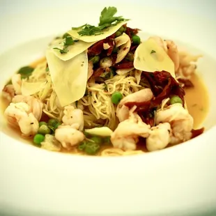 SPAGHETTINI CON GAMBERONI Extra Virgin Olive Oil, Garlic, Shrimp, Sundried Tomato, Peas, Aged Provolone, Crushed Red Chile