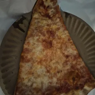 a slice of pizza on a paper plate
