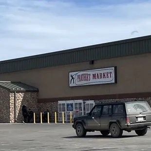 a car parked in front of the store