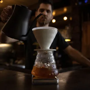a man pouring coffee