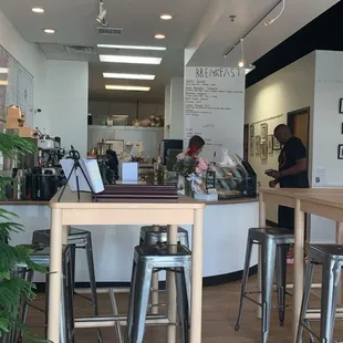 View of seating and a side view of the front counter