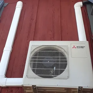 Our 2 zone condenser is mounted on the wall with nicely ran and covered copper lines to each wall unit. Very clean.  Great job team!!