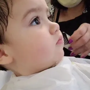 pat giving my son an amazing experience for his first haircut