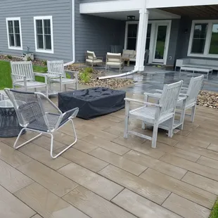 a patio with a table and chairs
