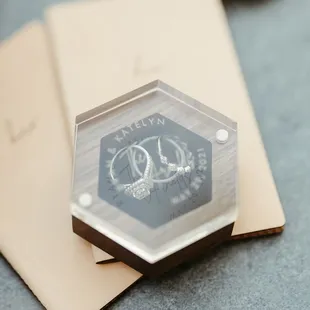 Custom ring boxes with casing and engraving for the bride and groom.