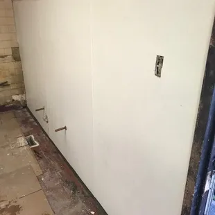 We replaced the FRP in this restaurant behind a three compartment sink. This was before.