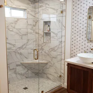 Framless Shower Door and Side Panel with Standard Clear Glass and Satin Brass Hardware.