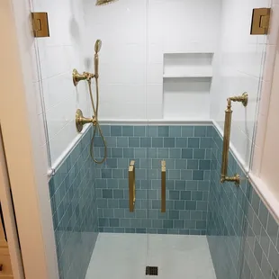 Frameless Double Doors with Small Knotch Cutouts for Tile Trim Line.