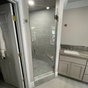 Framless Shower Door with Standard Clear Glass and Polished Nickel Hardware.