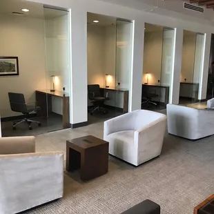 Lounge with personal work spaces with desks and plug-ins and Wi-Fi